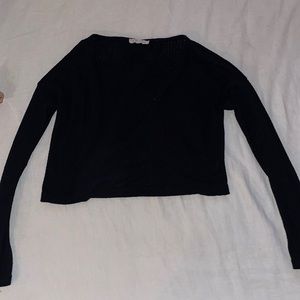 Black flowing crop top with split back